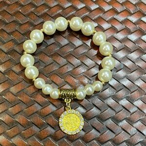 Elegant Gold and Cream Beaded Bracelet St. Benedict Charm